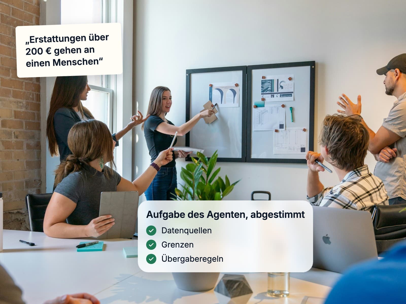 A team mapping an agent's job on a whiteboard in a workshop
